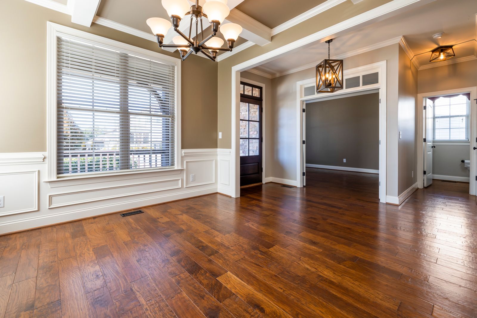 Basemolding — Detailed baseboard and crown molding / trim carpentry, painted white.